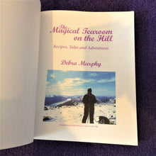 Load image into Gallery viewer, Inside of the book with a photo of a lady and a dog at the top of a mountain
